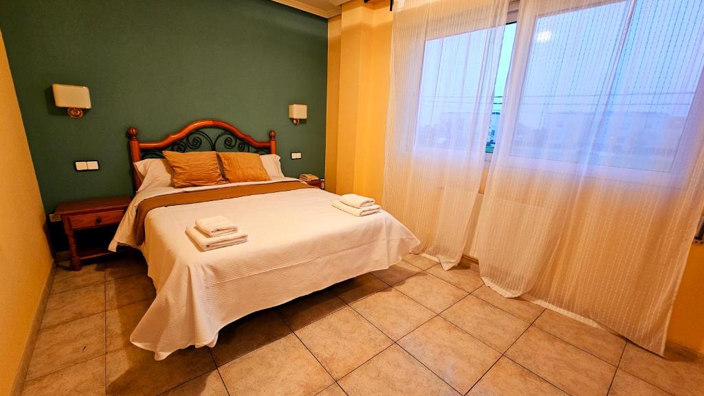 Łóżko lub łóżka w pokoju w obiekcie Hotel Mataleñas