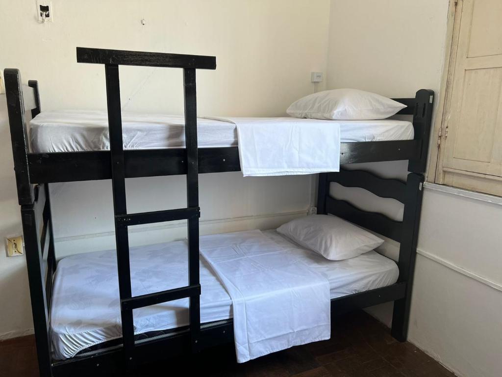 Postel nebo postele na pokoji v ubytování Calango Hostel