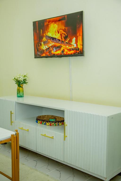 TV a/nebo společenská místnost v ubytování Tiny Haven executive one bedroom with free WIFI and Netflix