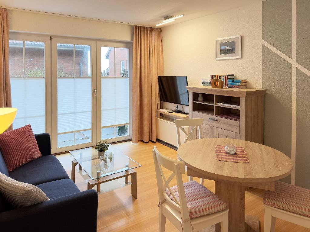 TV a/nebo společenská místnost v ubytování Haus Südspitze 18 Ferienwohnung Sand & Seele