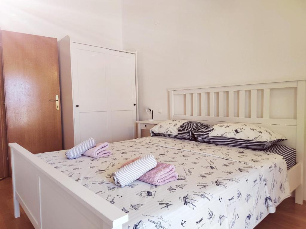 Postel nebo postele na pokoji v ubytování T&T Sea View Apartments