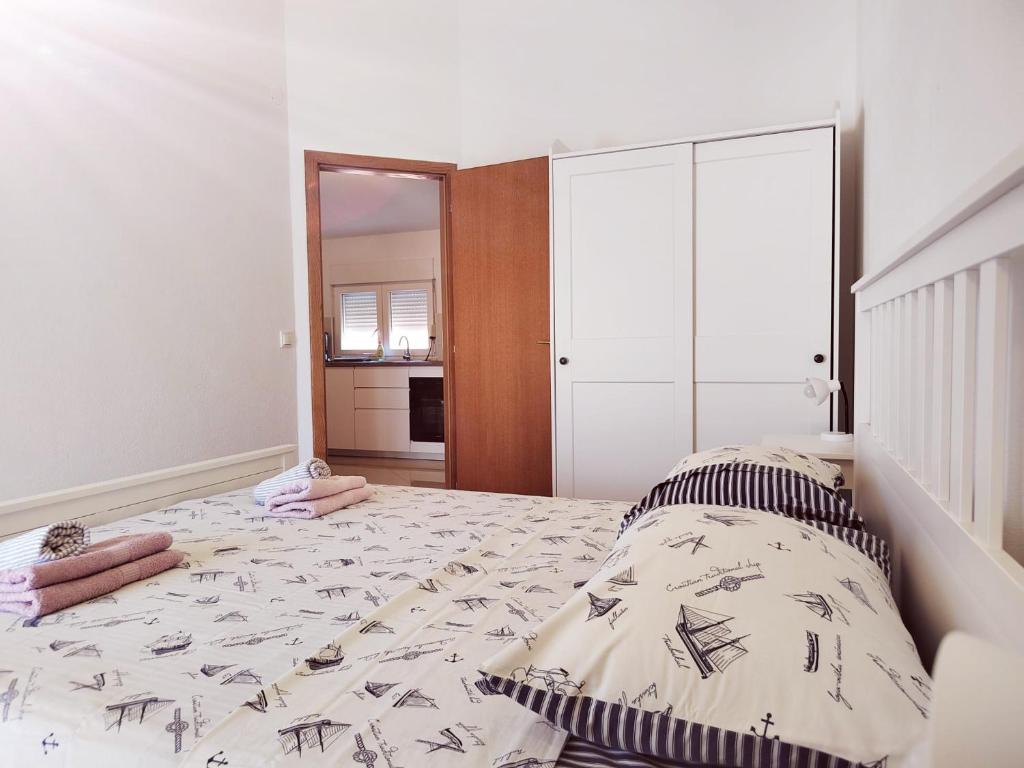 Postel nebo postele na pokoji v ubytování T&T Sea View Apartments