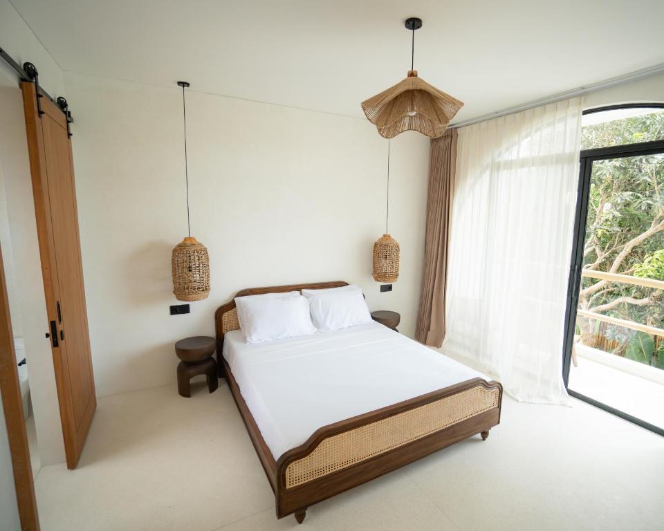 Ένα ή περισσότερα κρεβάτια σε δωμάτιο στο Tyde Bali Boutique Hotel