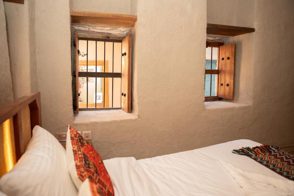Postel nebo postele na pokoji v ubytování Nomad Inn Nizwa
