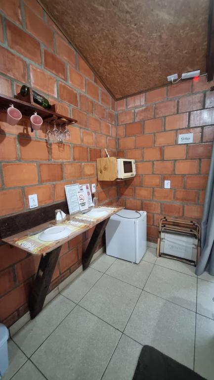 Kuchyň nebo kuchyňský kout v ubytování Chalés Fenix