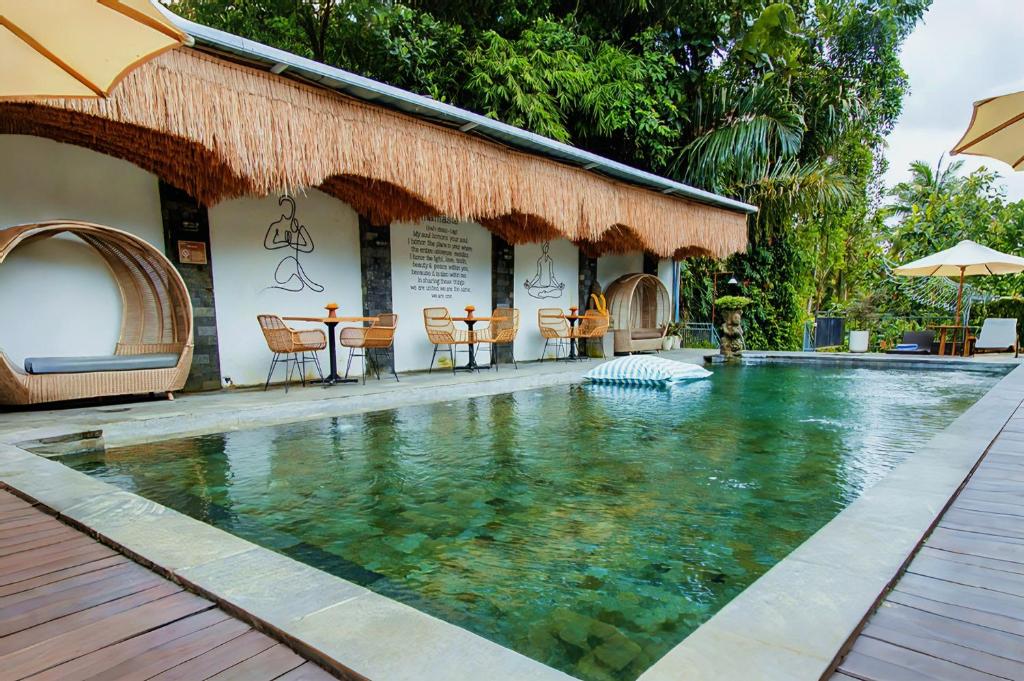 Bazén v ubytování Tattva Ubud Retreat & Wellness nebo v jeho okolí