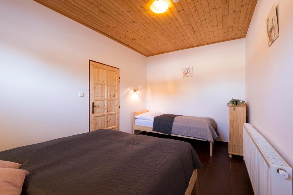 Postel nebo postele na pokoji v ubytování Panorama Kobylnice