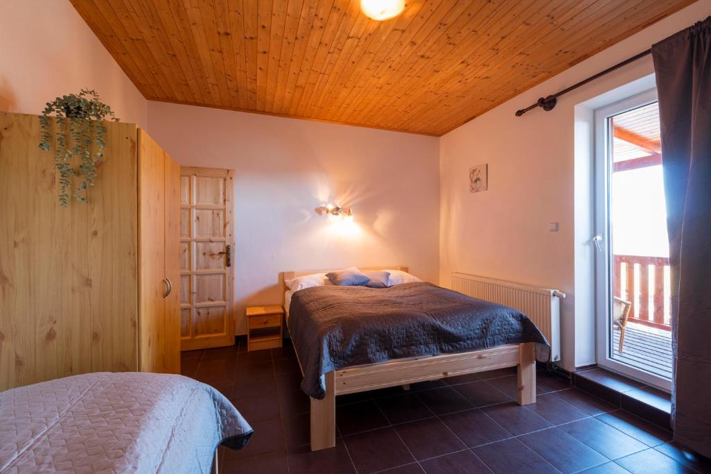 Postel nebo postele na pokoji v ubytování Panorama Kobylnice