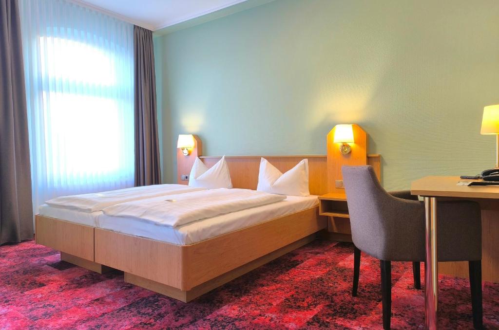 Postel nebo postele na pokoji v ubytování Hotel Burgas