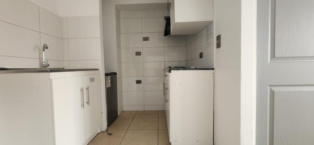 Kuchyň nebo kuchyňský kout v ubytování Apart Hotel Azimut Iquique