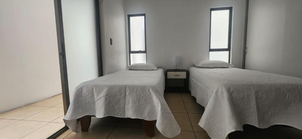 Postel nebo postele na pokoji v ubytování Apart Hotel Azimut Iquique