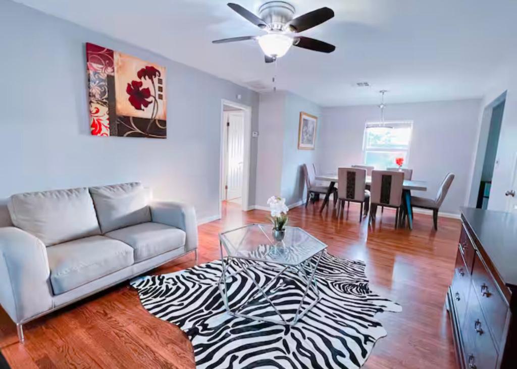 a living room with a couch and a table at Pet friendly 3 bedroom house in Oklahoma City