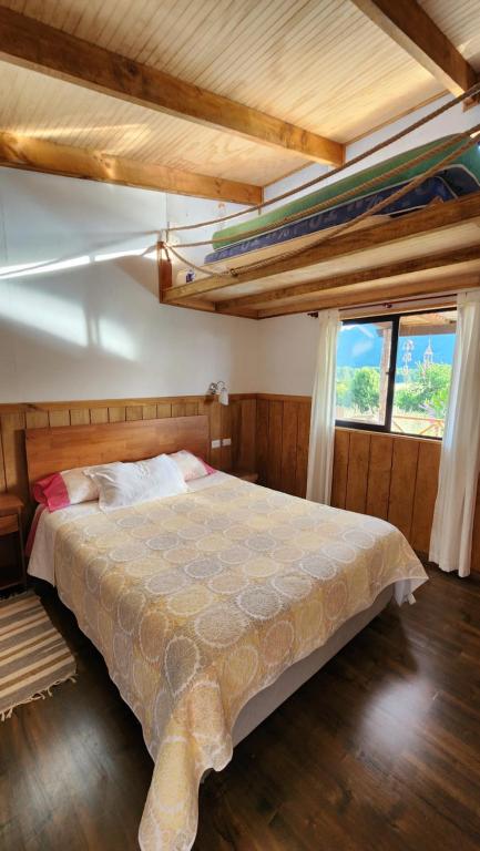 En eller flere senge i et værelse på Casa cerro