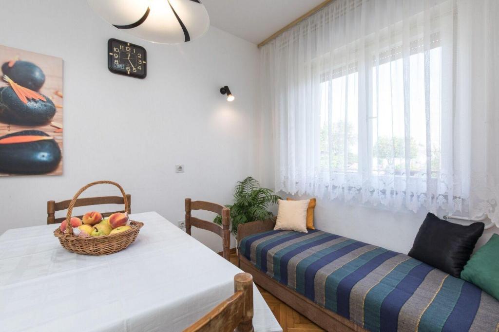 Postel nebo postele na pokoji v ubytování Apartments Kate