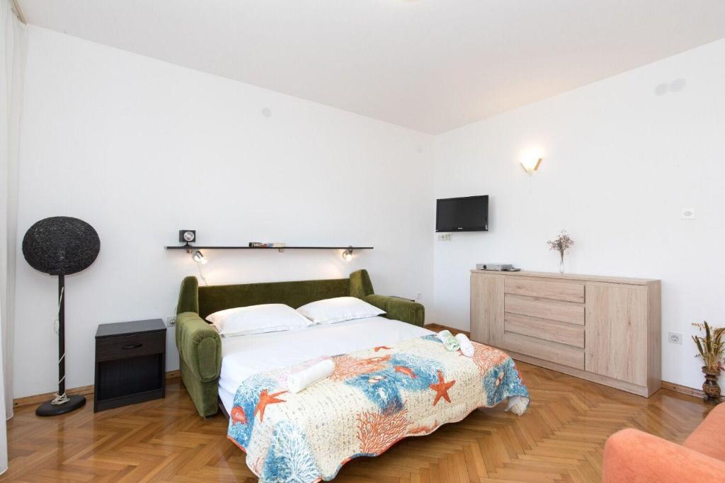 Postel nebo postele na pokoji v ubytování Apartments Kate