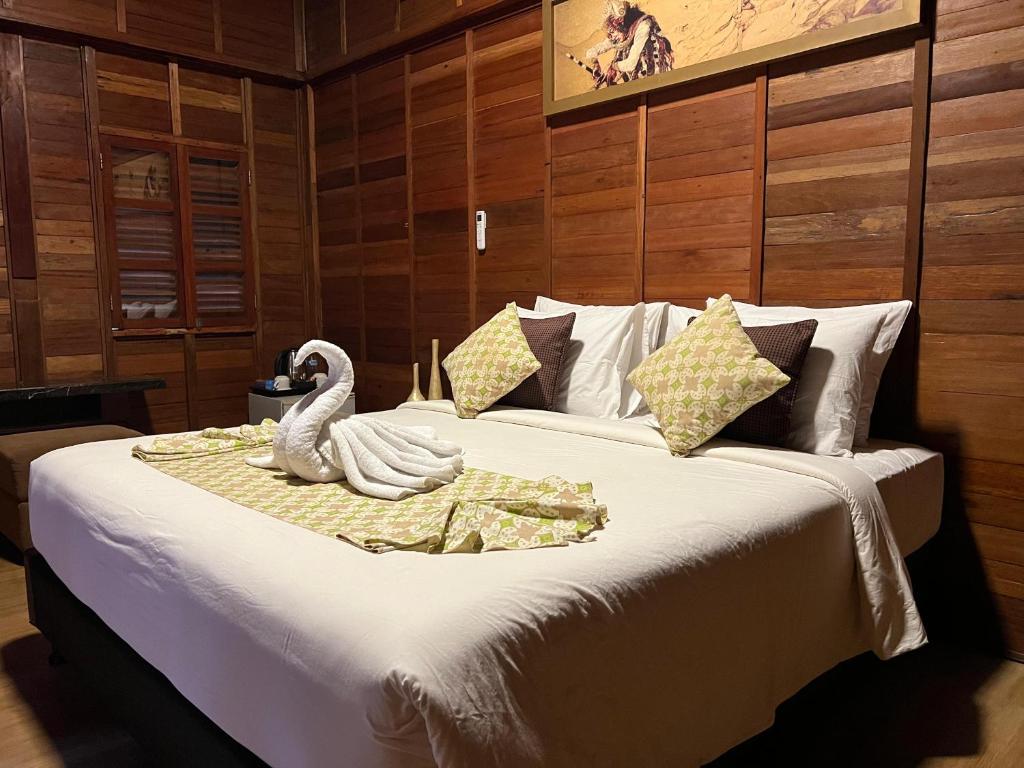 Postel nebo postele na pokoji v ubytování Mahayana Guest House
