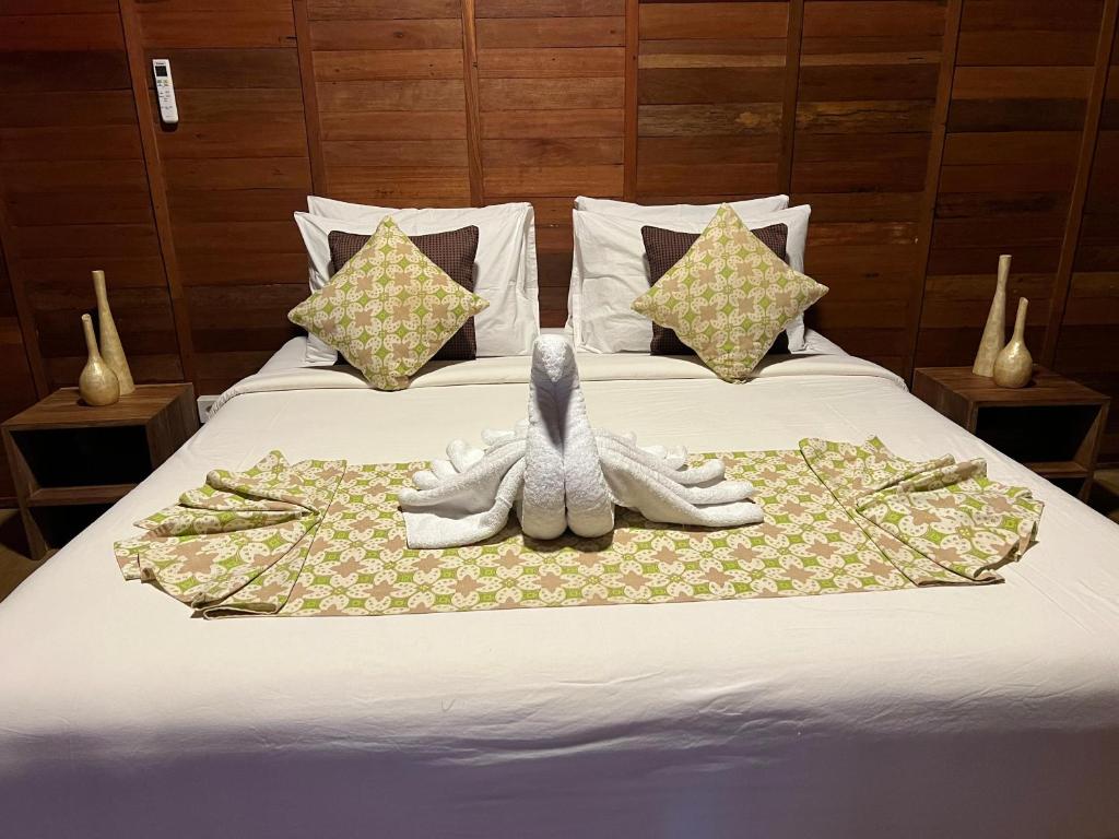 Postel nebo postele na pokoji v ubytování Mahayana Guest House