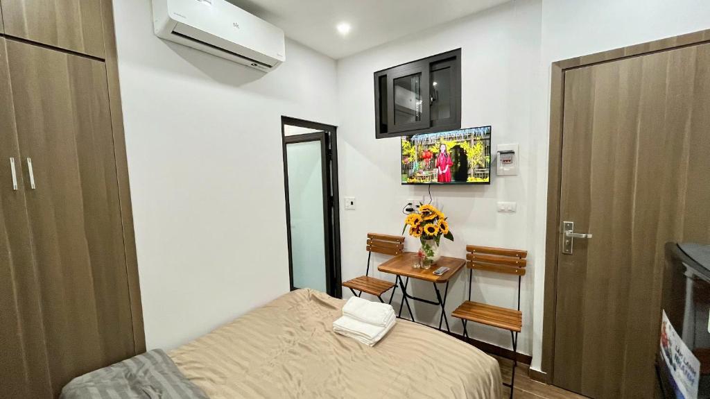 Postel nebo postele na pokoji v ubytování Era Apartment - Chùa Láng
