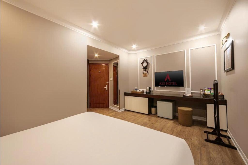 Postel nebo postele na pokoji v ubytování A25 Hotel - 23 Quán Thánh