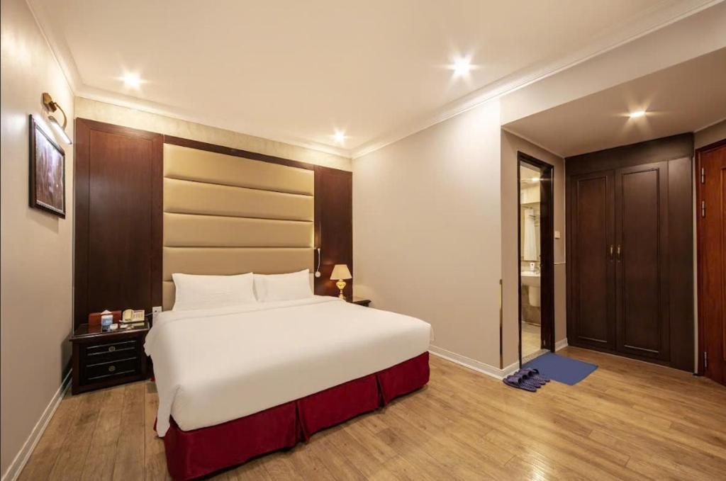 Postel nebo postele na pokoji v ubytování A25 Hotel - 23 Quán Thánh