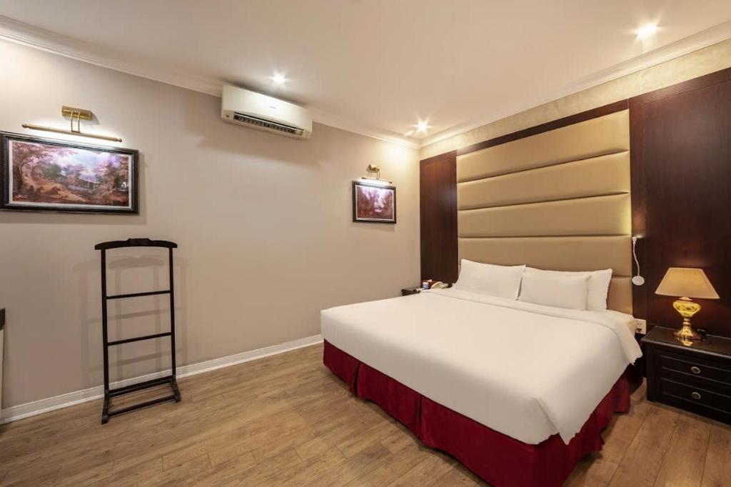 Postel nebo postele na pokoji v ubytování A25 Hotel - 23 Quán Thánh