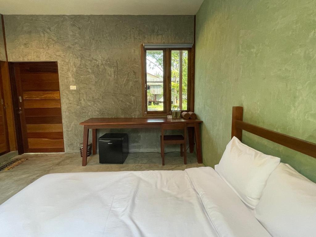 Postel nebo postele na pokoji v ubytování COCO HOME Homestay(โคโค่โฮม)