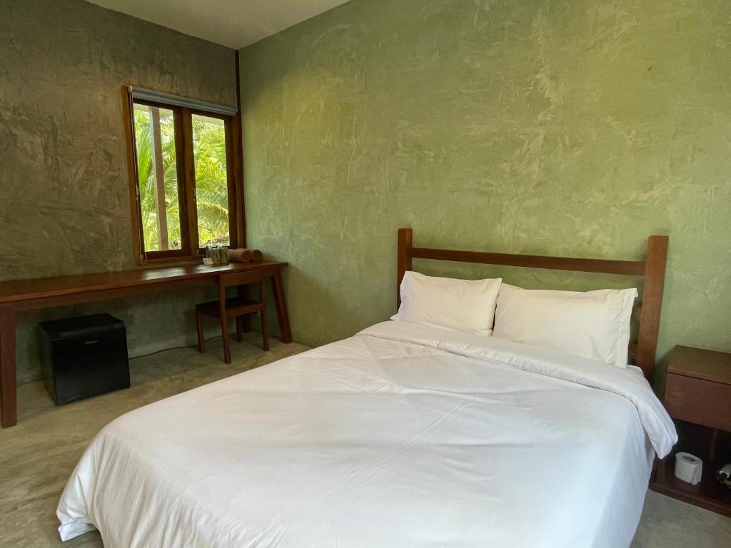 Postel nebo postele na pokoji v ubytování COCO HOME Homestay(โคโค่โฮม)