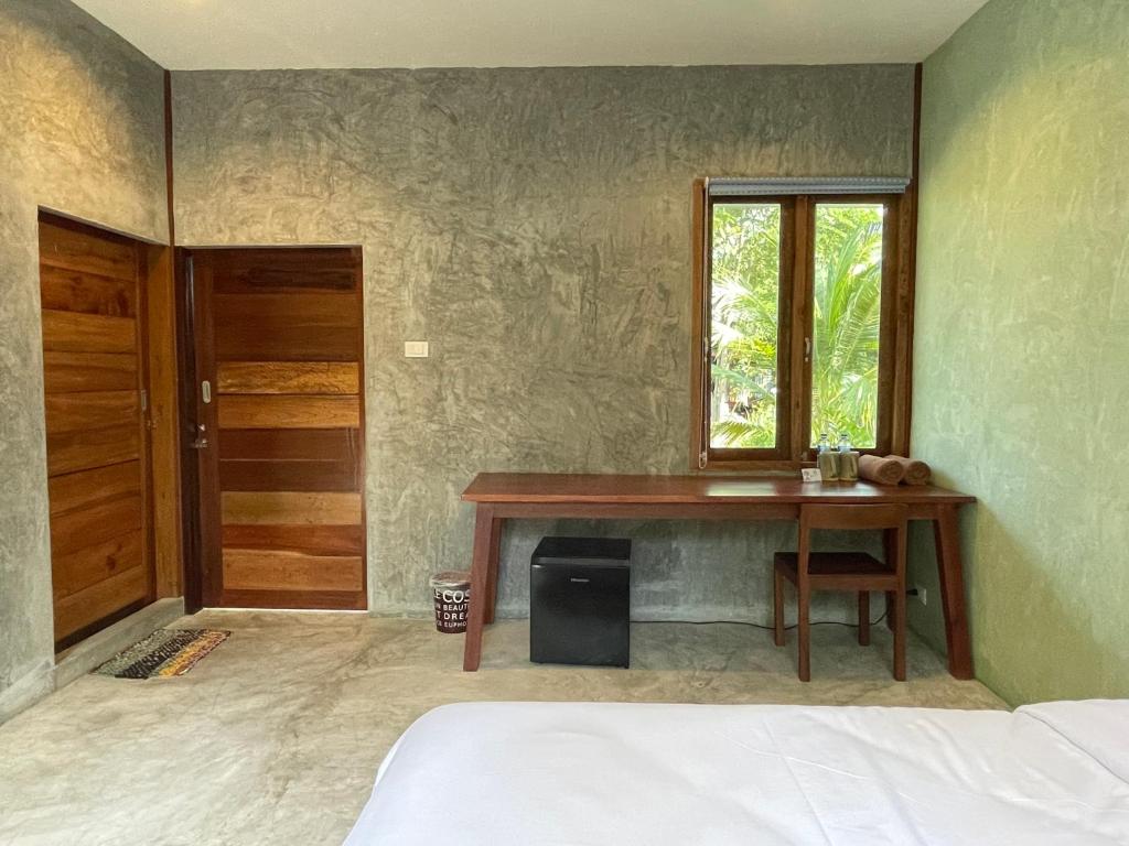 Postel nebo postele na pokoji v ubytování COCO HOME Homestay(โคโค่โฮม)
