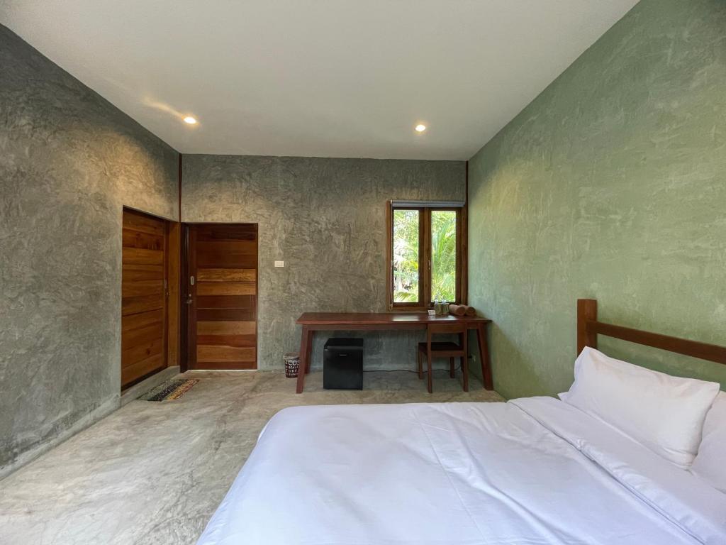 Postel nebo postele na pokoji v ubytování COCO HOME Homestay(โคโค่โฮม)