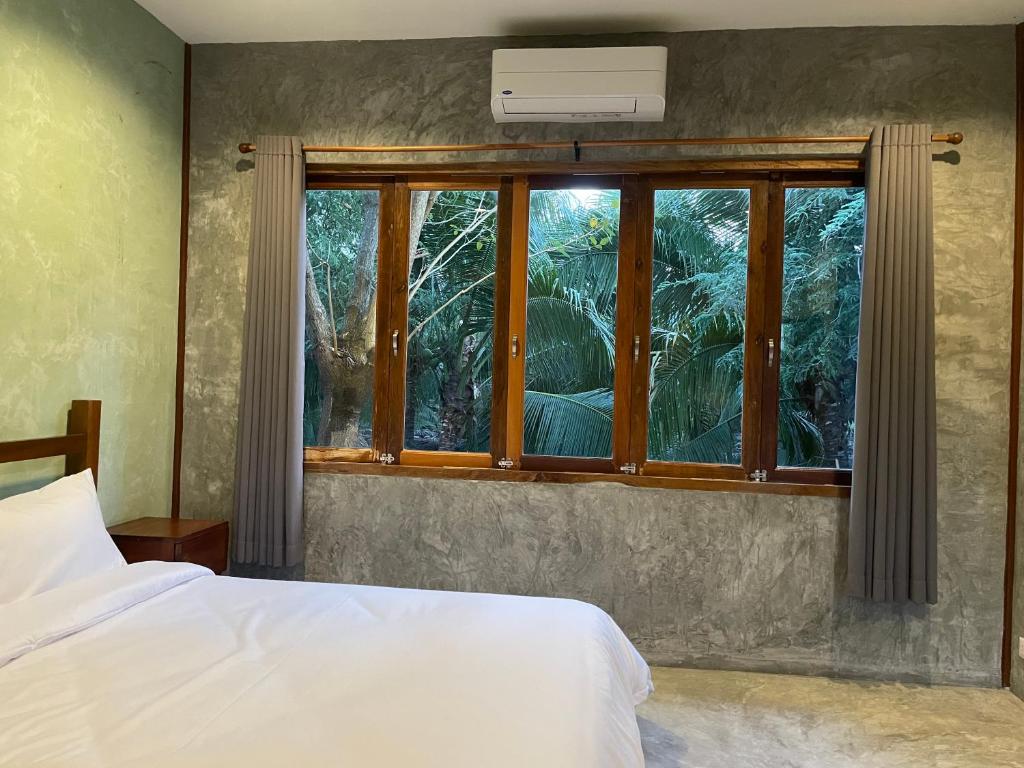 Postel nebo postele na pokoji v ubytování COCO HOME Homestay(โคโค่โฮม)