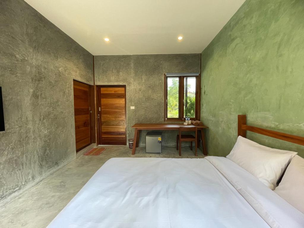 Postel nebo postele na pokoji v ubytování COCO HOME Homestay(โคโค่โฮม)