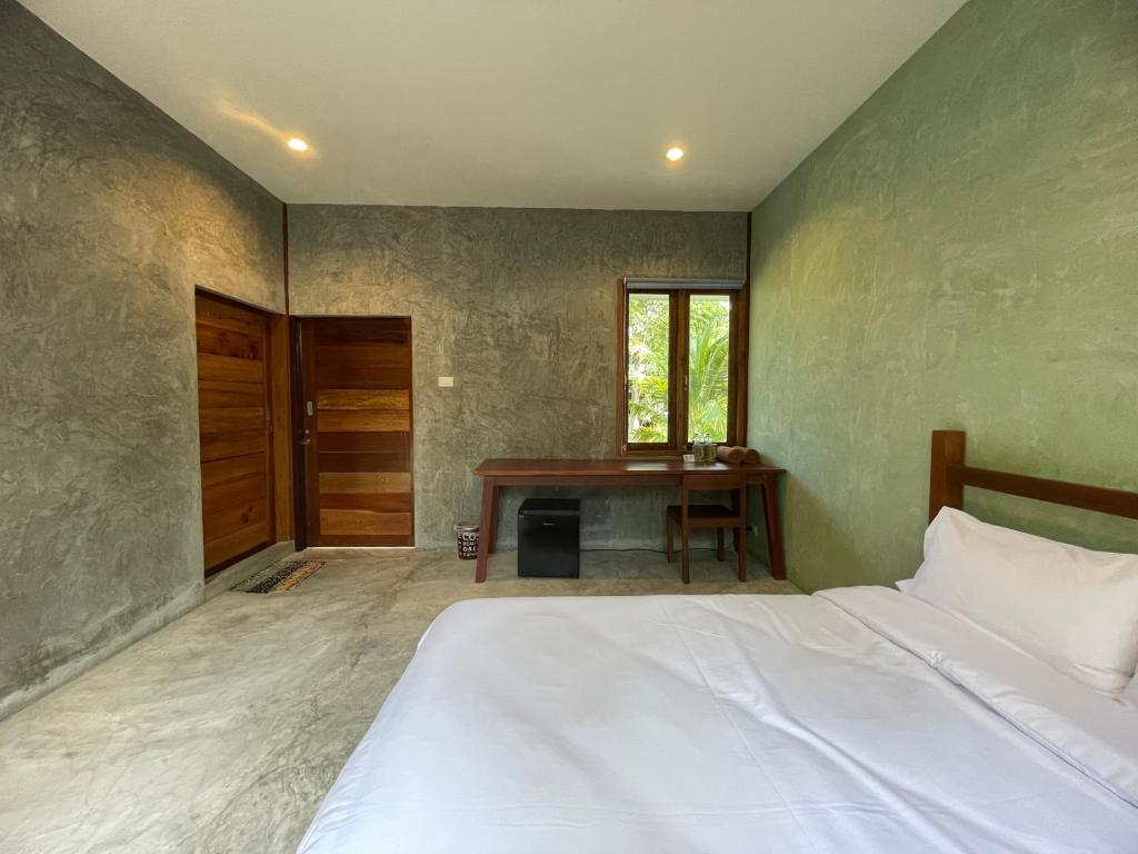 Postel nebo postele na pokoji v ubytování COCO HOME Homestay(โคโค่โฮม)