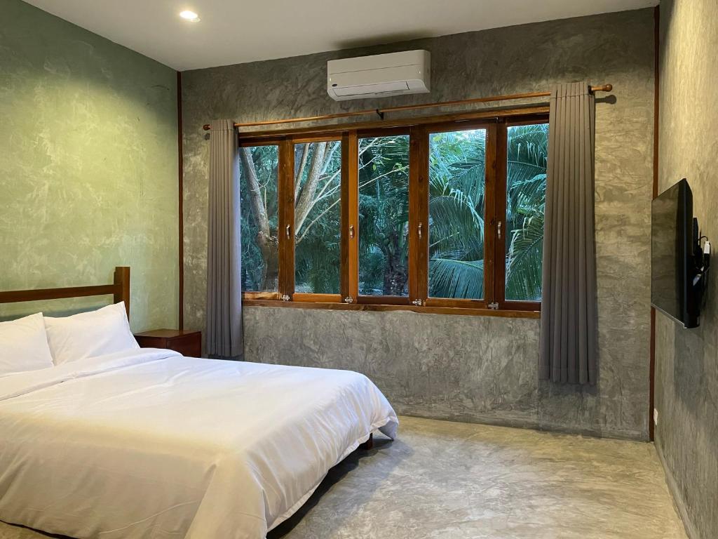 Postel nebo postele na pokoji v ubytování COCO HOME Homestay(โคโค่โฮม)