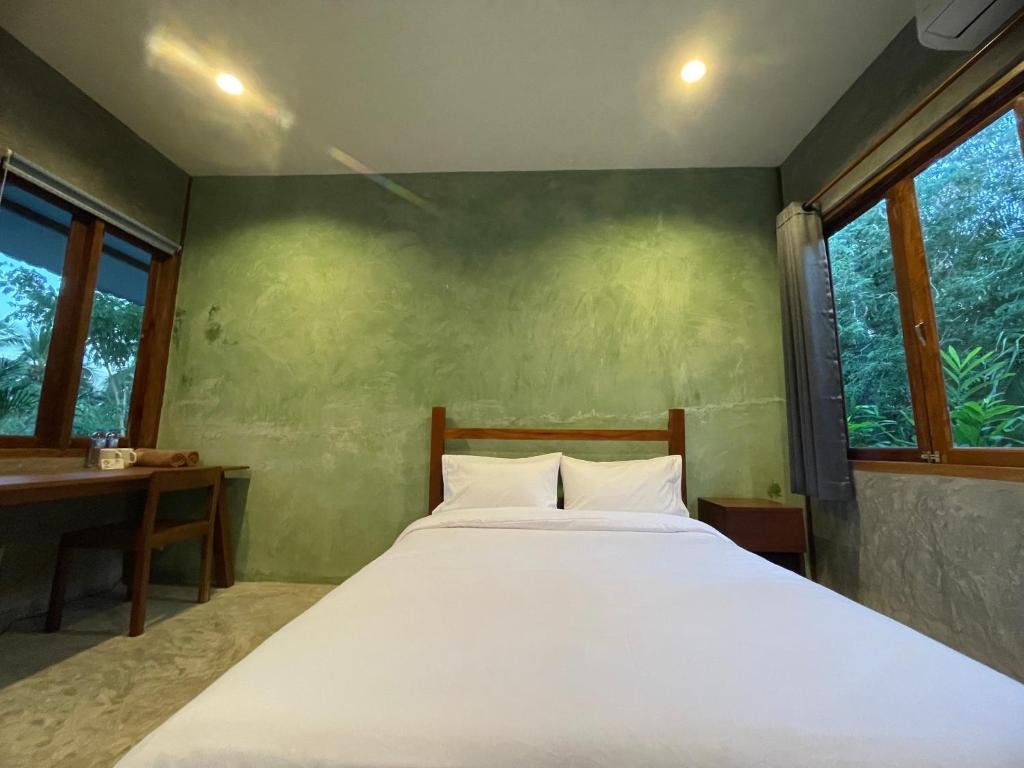 Postel nebo postele na pokoji v ubytování COCO HOME Homestay(โคโค่โฮม)
