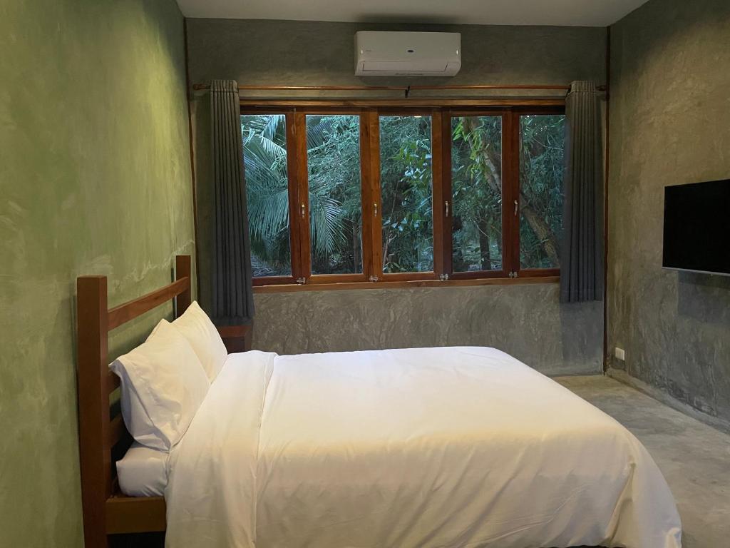 Postel nebo postele na pokoji v ubytování COCO HOME Homestay(โคโค่โฮม)