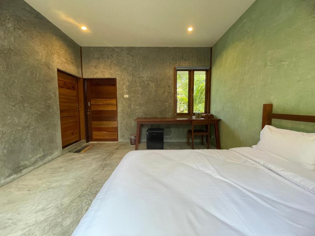 Postel nebo postele na pokoji v ubytování COCO HOME Homestay(โคโค่โฮม)