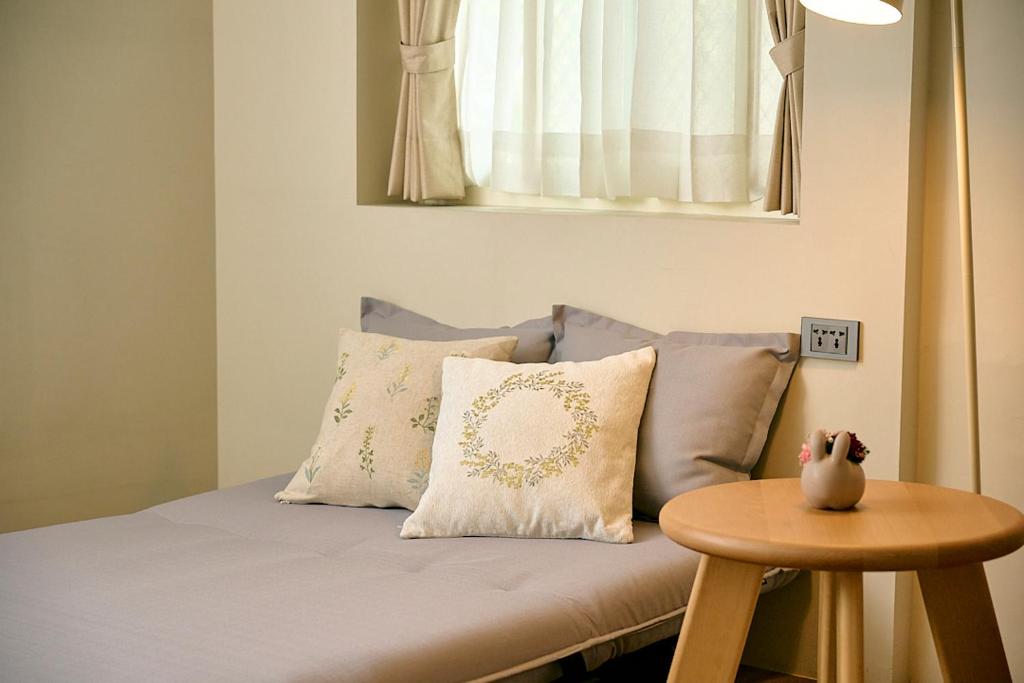 Postel nebo postele na pokoji v ubytování Qingyu B&B