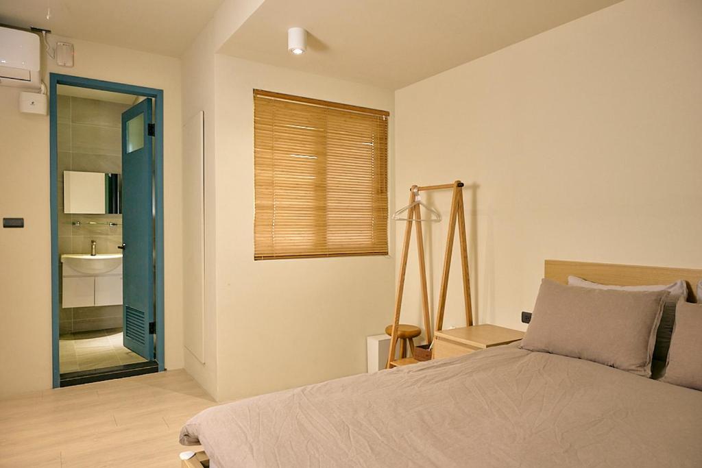 Postel nebo postele na pokoji v ubytování Qingyu B&B