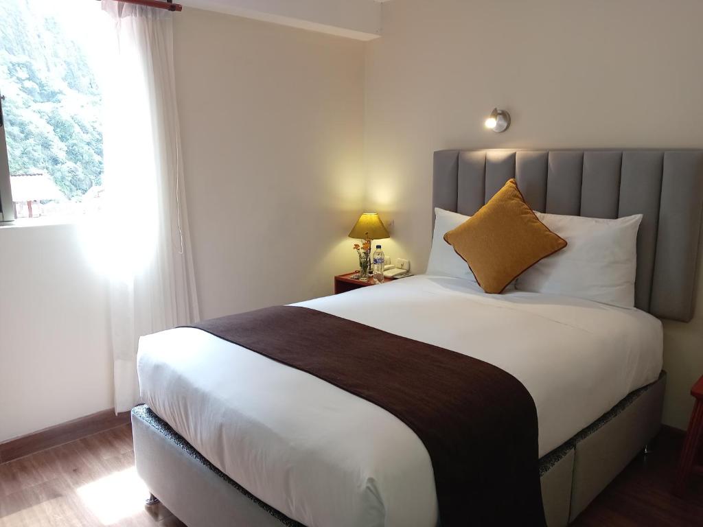 Postel nebo postele na pokoji v ubytování Hotel Pucara Machupicchu