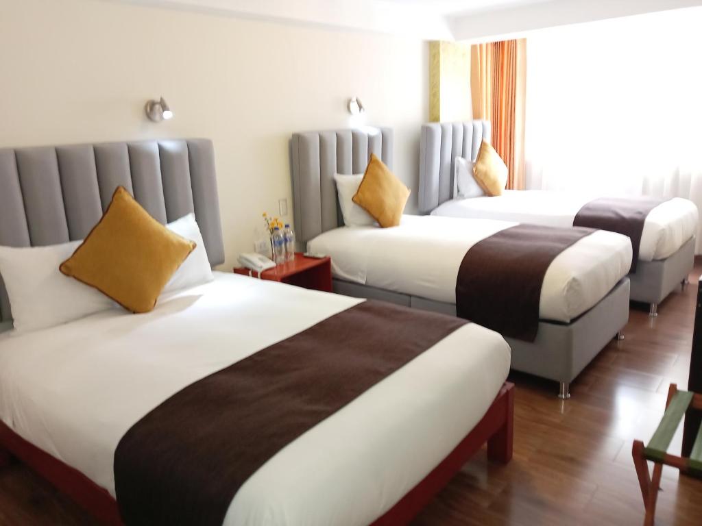 Postel nebo postele na pokoji v ubytování Hotel Pucara Machupicchu