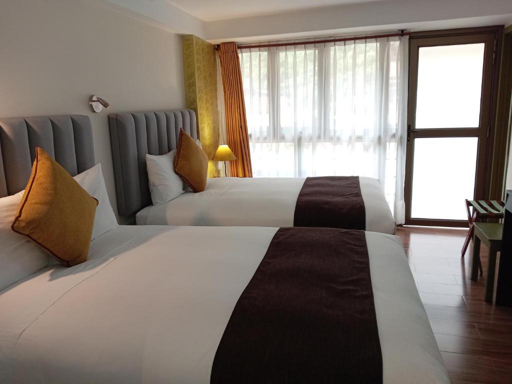 Postel nebo postele na pokoji v ubytování Hotel Pucara Machupicchu