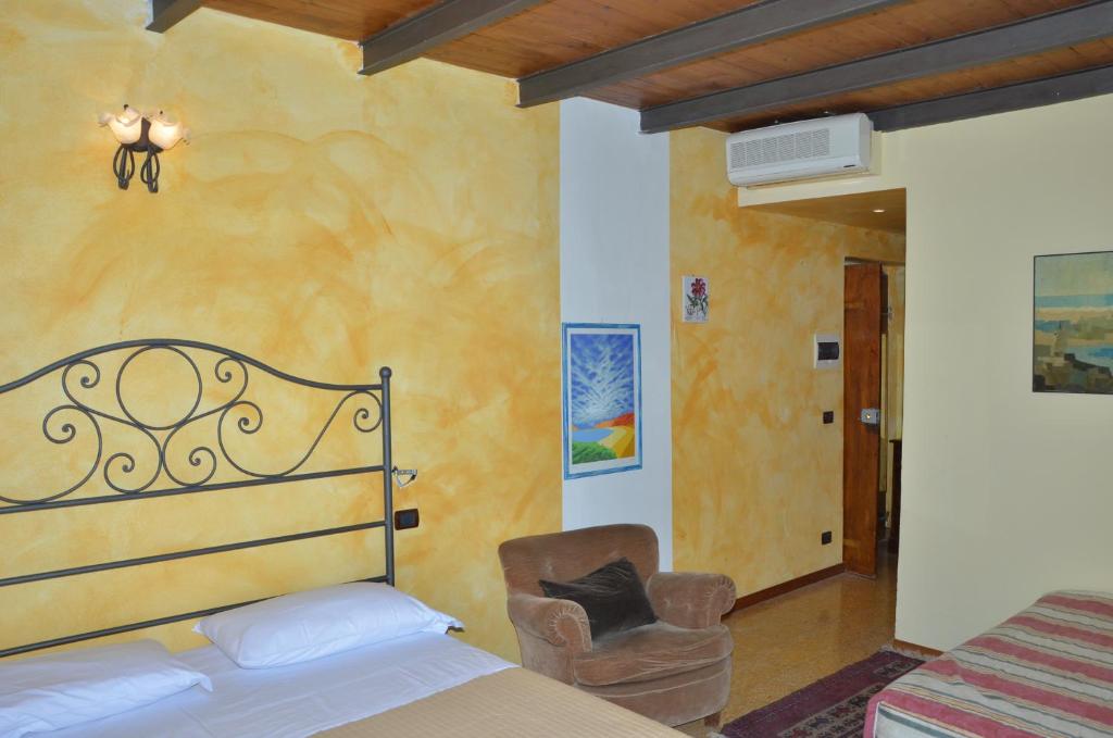 Postel nebo postele na pokoji v ubytování Locanda Dal Moccia