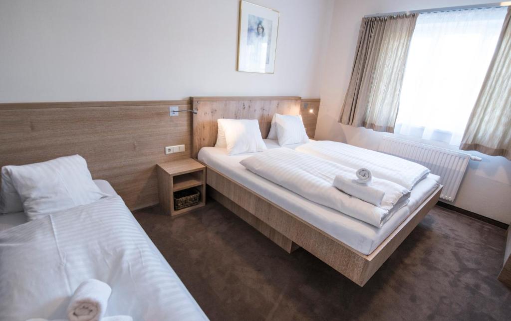 A bed or beds in a room at Crystls Aparthotel
