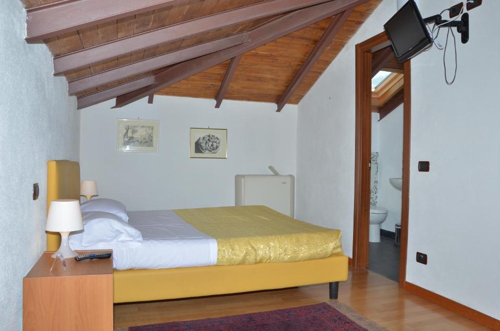 Postel nebo postele na pokoji v ubytování Locanda Dal Moccia