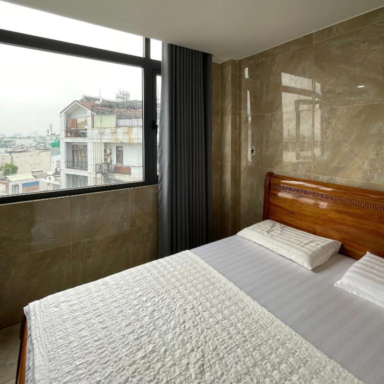 Postel nebo postele na pokoji v ubytování Le Lai Hotel