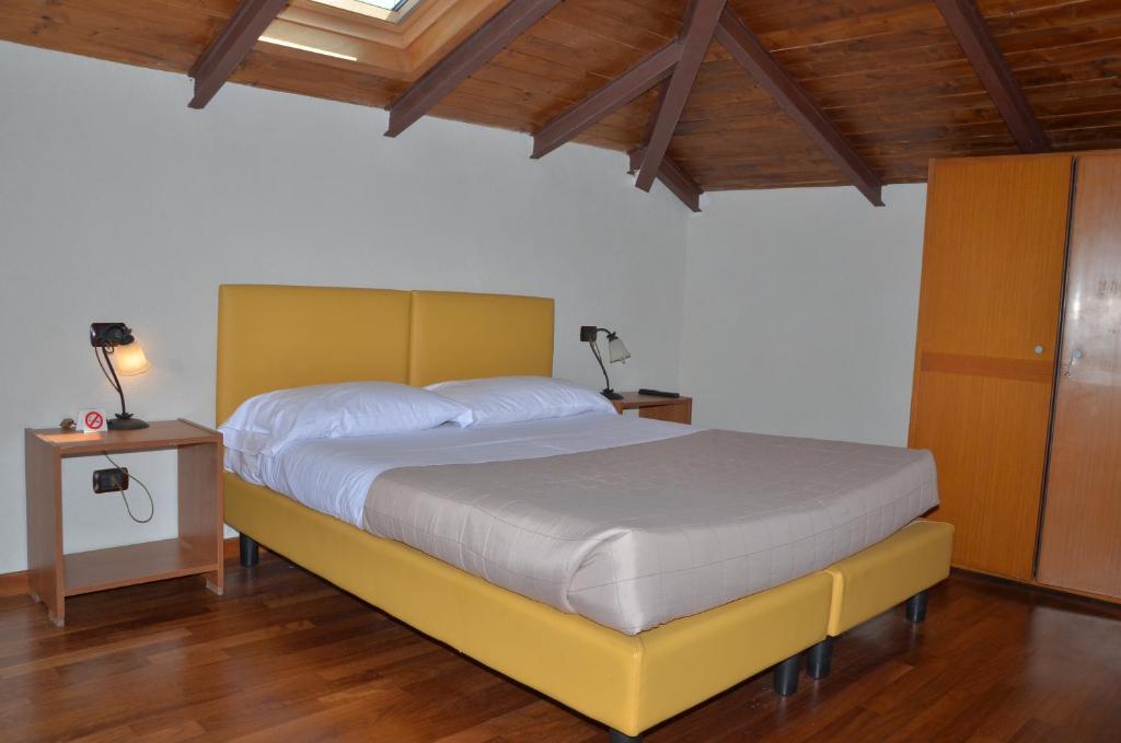 Postel nebo postele na pokoji v ubytování Locanda Dal Moccia