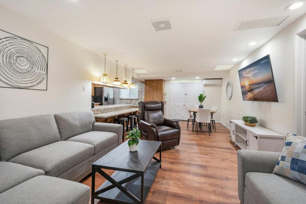a living room with a couch and a table at Newly Renovated Home Spacious Close 2 Hospital in San Bernardino