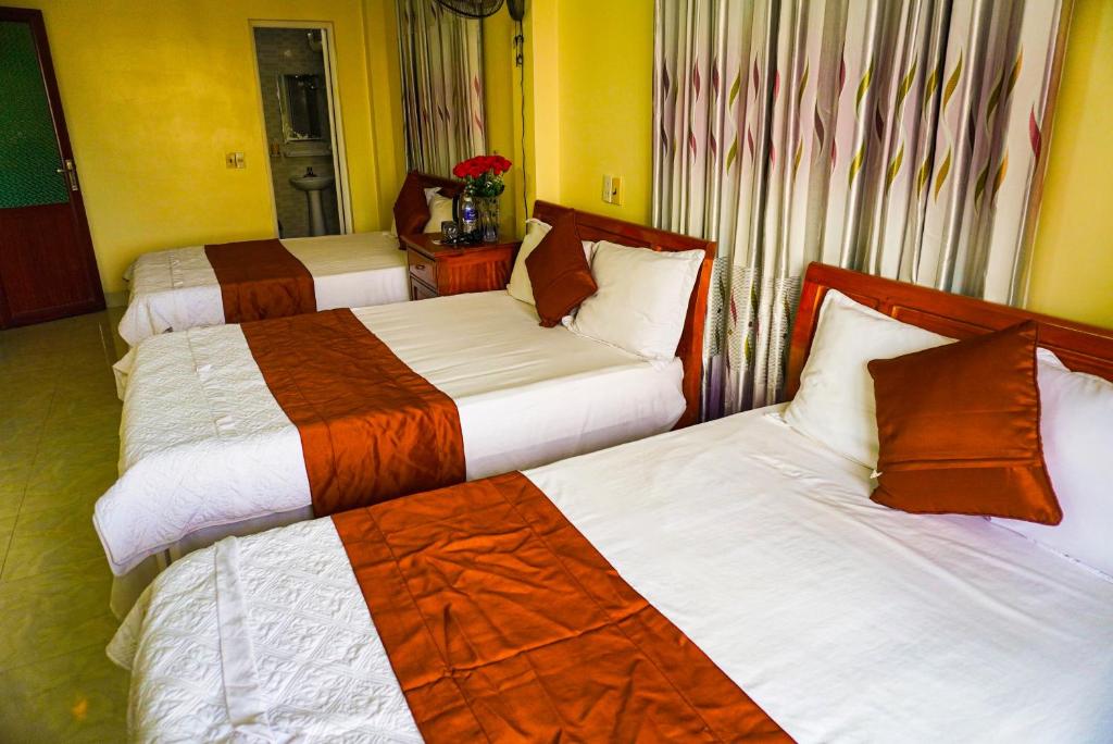 Postel nebo postele na pokoji v ubytování Phong Nha Orient Homestay