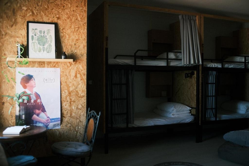 Postel nebo postele na pokoji v ubytování A Forest Homestay