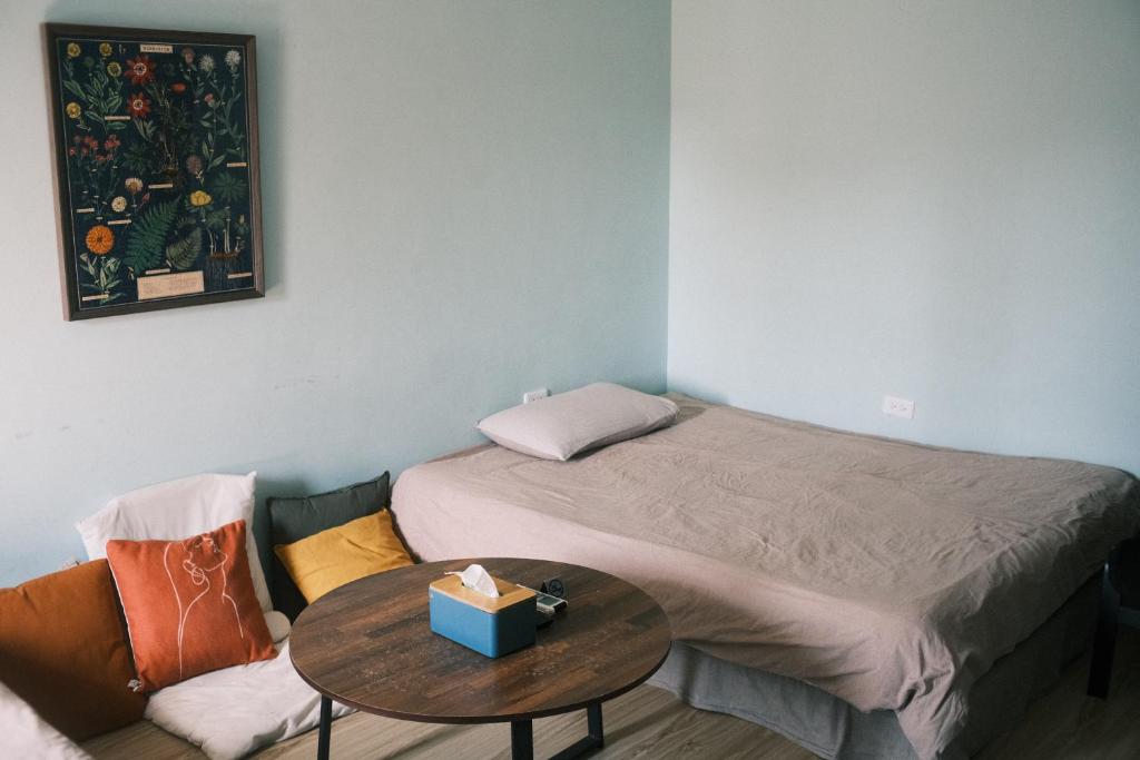 Postel nebo postele na pokoji v ubytování A Forest Homestay